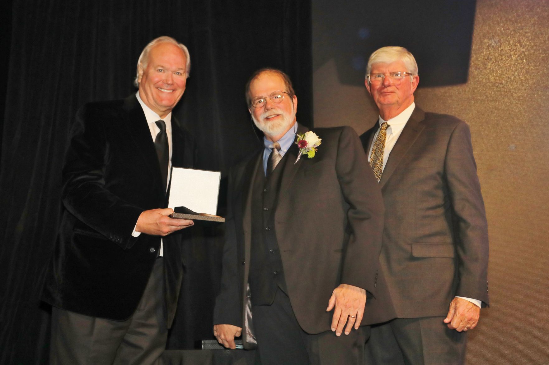Dick Miles, Chairman of the Board, John Sexton, honoree, Bob Bishop, chair of induction committee and board member